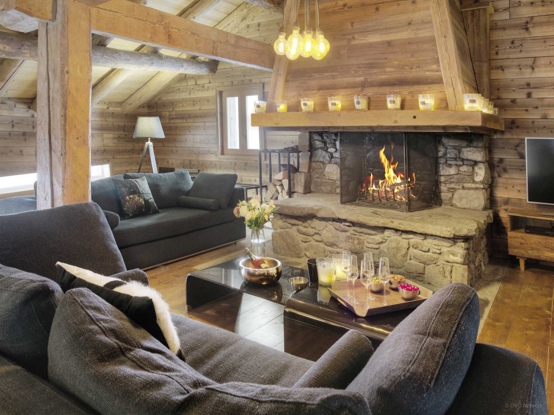 Chalet lounge with log fire feature.