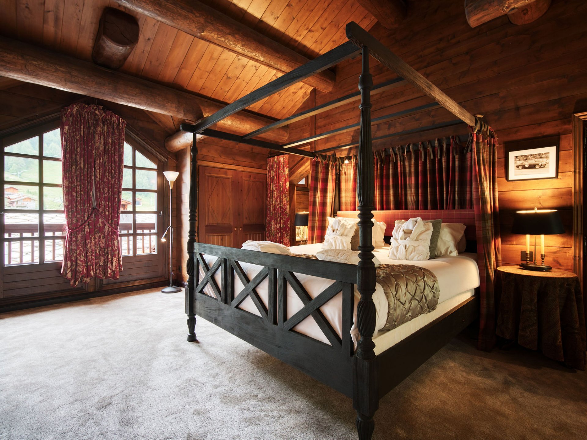 Chalet bedroom with four poster bed feature.